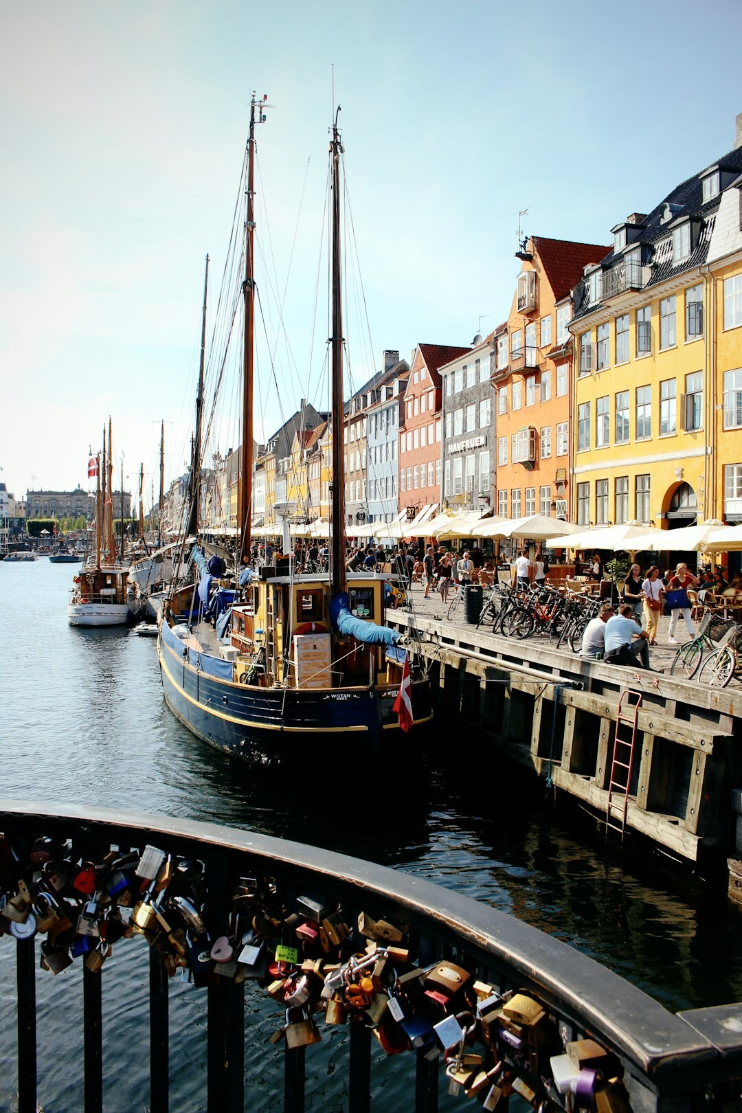 Nyhavn harbour in Copenhagen with cyclists