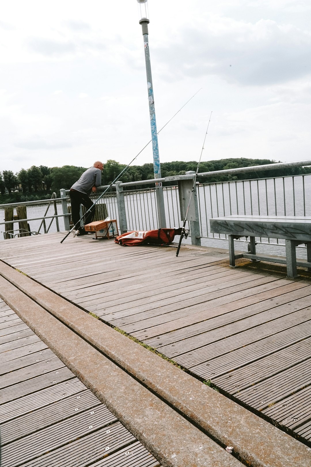 Danish fisherman mending nets on a wooden pier