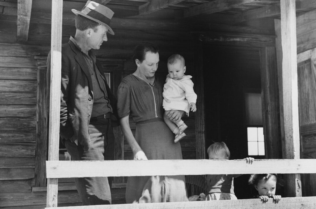 Danish family sitting together on a porch at dusk